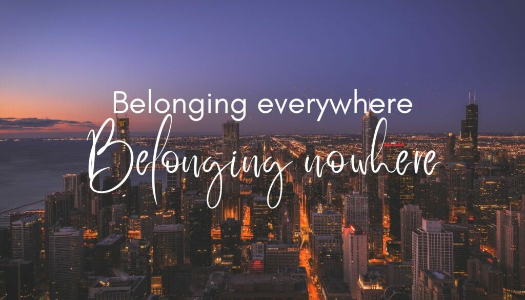 belonging everywhere, belonging nowhere text: belonging everywhere, belonging nowhere. Image of city with high-rise buildings at sunset