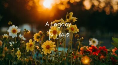 Text: A legacy to Leave on a background of flowers with a sunrise in the far background