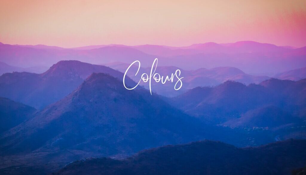 Colours Text: Colours on a background silhouette of mountains against clouds