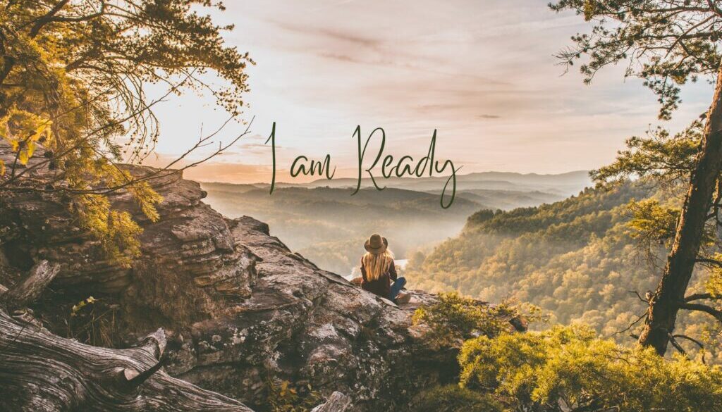 I am ready Text: I am ready against a background picture of a blonde girl with a hat sitting on a cliff overlooking mountains